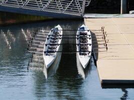 Berkeley, CA, 2007 - Two Empty Rowing Shells Sitting At Dock Side photo