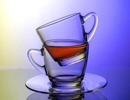 a glass cup with a tea  inside photo