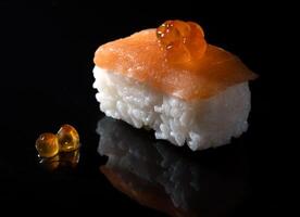 a sushi roll with salmon photo