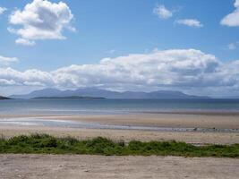View to the Isle of Arran from Ettrick Bay on the Isle of Bute, Scotland photo