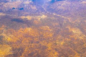 Flying airplane over Mexico Clouds Sky Volcanoes Mountains City desert. photo