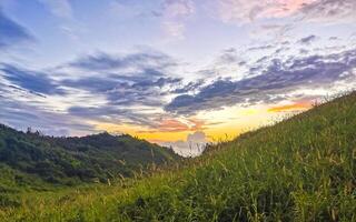 Punta Playa Cometa sunset panorama view mountains rocks Mazunte Mexico. photo