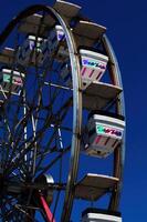 Sacramento, CA, 2011 - Ferris Wheel Cars Against Dark Blue Sky photo