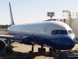 Sacramento, CA, 2008 - Commercial Aircraft Being Serviced At Airport Terminal photo