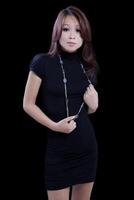 Young Asian American Woman Standing Black Dress photo