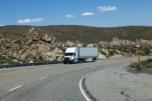 Mono Lake, CA, 2012 - Truck Coming Downhill On Four Lane Highway photo