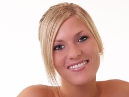 Young blond woman with half smile portrait photo