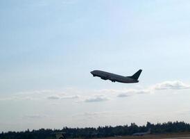 Seattle, WA, 2006 - Jet Takeoff In Blue Sky With White Clouds photo