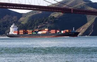 San Francisco, CA, 2014 - Container Cargo Ship Sailing In Under Golden Gate Bridge photo