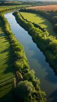 ai generado tranquilo campo perezoso río serpenteante mediante verde valles foto