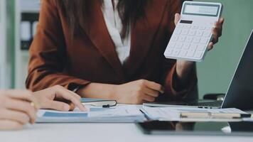 Finance manager meeting discussing company growth project success financial statistics, professional investor working start up project for strategy plan with document, laptop and digital tablet. video