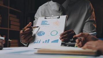 Finance manager meeting discussing company growth project success financial statistics, professional investor working start up project for strategy plan with document, laptop and digital tablet. video