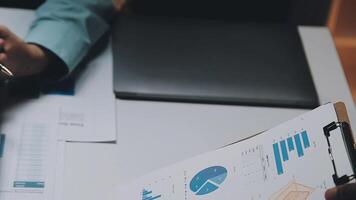 Finance manager meeting discussing company growth project success financial statistics, professional investor working start up project for strategy plan with document, laptop and digital tablet. video