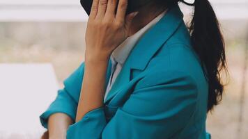 Businesswoman using phone, taking notes at office desk video