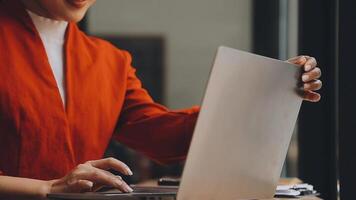 Businesswoman using phone, taking notes at office desk video