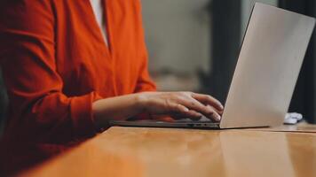 Businesswoman using phone, taking notes at office desk video