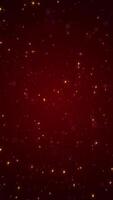 Vertical video - shiny twinkling golden stars and bokeh particles on a dark red gradient. This elegant luxury background is full HD and a seamless loop.