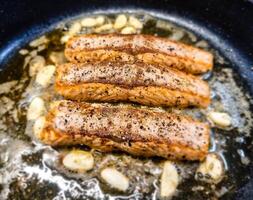 Fresh Salmon filet with herbs and spices photo