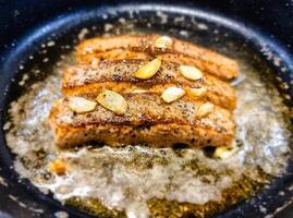 Fresh Salmon filet with herbs and spices photo
