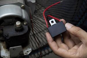 Capacitors in the fan motor circuit, fan repair technician photo