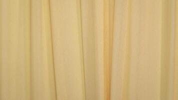yellow cream crepe paper - background with crinkled texture photo