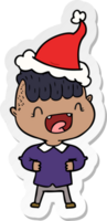 sticker cartoon of a happy boy laughing wearing santa hat png