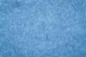 background of blue textured handmade mulberry paper photo