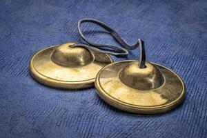 tingsha cymbals used in the Tibetan religion in prayers, rituals, meditation, and healing photo