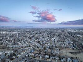 winter dawn over city of Fort Collins and Front Range of Rocky Mountains in northern Colorado photo