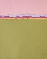 abstract paper landscape in pink and green pastel tones - collection of handmade rag papers photo