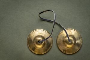 tingsha cymbals used in the Tibetan religion in prayers, rituals, meditation, and healing photo