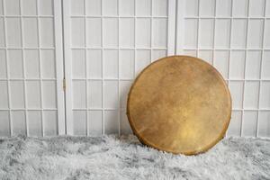 handmade, native American style, shaman frame drum covered by goat skin photo