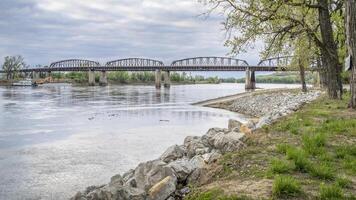 road and railroad bridges across the Missouri River and a boat ramp at Glasgow, MO, springtime scenery photo
