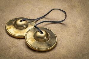 tingsha cymbals used in the Tibetan religion in prayers, rituals, meditation, and healing photo