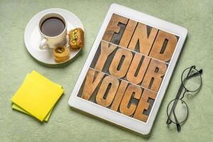 find your voice - word abstract in letterpress wood type on a tablet, personal development and creativity concept photo