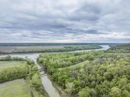Missouri River and Katy Trail crossing Cedar Creek above Jefferson City, MO, cloudy spring aerial view photo