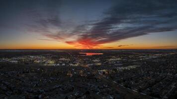 winter sunrise over midtown of Fort Collins, lakes and plains in northern Colorado, aerial panorama photo