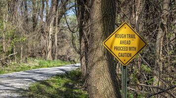 rough trail ahead, proceed with caution - warning sign on Steamboat Trace Trail converted from old railroad near Peru, Nebraska photo