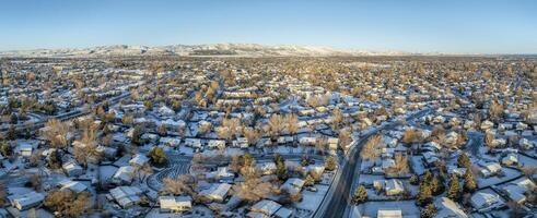 winter morning over city of Fort Collins and Front Range of Rocky Mountains in northern Colorado, aerial panorama photo