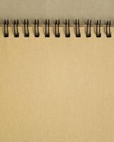 blank spiral notebook on art paper in earth tones photo