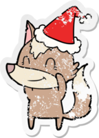 friendly hand drawn distressed sticker cartoon of a wolf wearing santa hat png