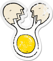 distressed sticker of a cartoon cracked egg png