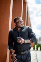 Male portrait of lifestyle in casual clothes. Handsome young man in black shirt posing for camera. photo