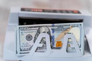 Dollar counting equipment in bank. Money banking counter. photo