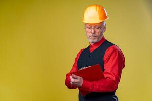 Serious general contractor or real estate investor concept with elegant man with beard, glasses and building helmet. Man in elegant shirt. Copy space. photo