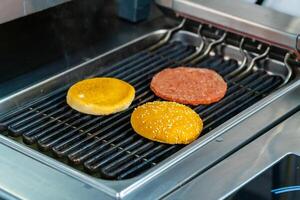 Delicious frying cutlet on the grill. Roasted cooking grill dinner. photo