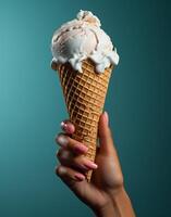 AI generated Ice cream in waffle cone in female hand on turquoise background photo