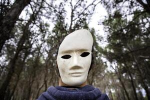 Halloween masks in the forest photo