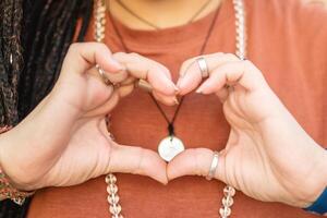 Hands of a woman in the shape of a heart. photo