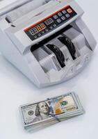 Cash counting machine. Bank equipment for count money. photo